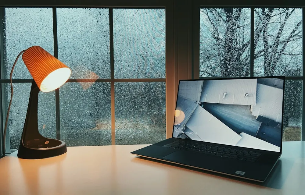 A laptop on a desk, ready for an online IP training session